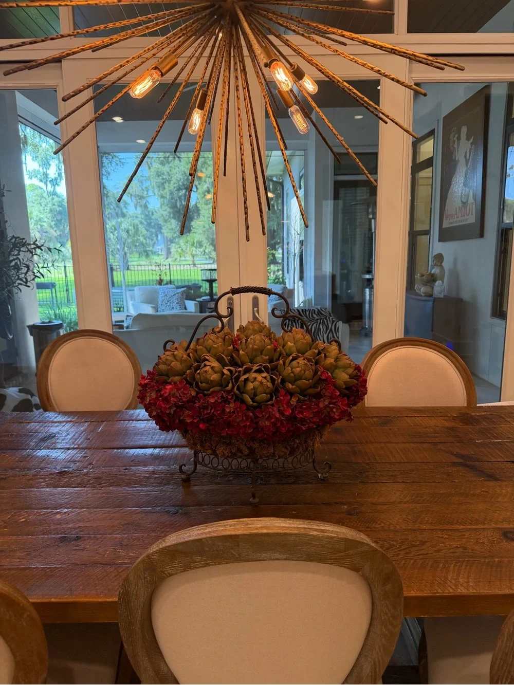 Rustic Iron Basket Centerpiece with Green Artichoke and Red Hydrangea Accents